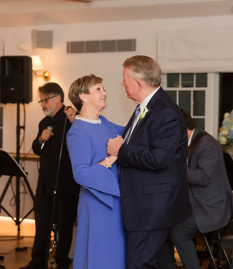 Couple dancing at Belvedere Lenox event, showcasing joyful celebration atmosphere, featuring live music and elegant attire.